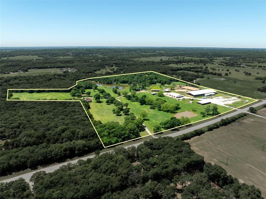Prime 51.74-Acre Equine Facility! This expansive equine property offers an unparalleled opportunity for horse enthusiasts, livestock operations, or those looking for a recreational business venture. With easy access and excellent visibility, it offers everything you need for business or personal use, and it’s ready for its next chapter! Key features include location and accessibility, an indoor arena and facilities, barns and stalls, livestock facilities, additional storage buildings, residential living quarters and 1,250' of prime road frontage. Conveniently located for travel to DFW and OKC, making it an ideal spot for competitive equine or livestock events. 115 x 265 Indoor arena is ideal for year-round training or events.  3-2,400-gallon tanks provide water for the arena. Separate restrooms and 14 RV hookups with 30-amp connections for guests or event participants. Water well and RV clean-out facilities for added convenience. 120x80’ Show Barn has 16 stalls.  A 2nd 50x90’ barn with 18 portable 10x10 stalls is great for temporary use, events, or additional storage. 100x20’ hay storage shed can be adapted for a variety of needs. 8-50x40’ holding pens connect to a central alleyway for seamless livestock movement. Three pastures accessible via the alley are perfect for grazing or turn-out. 15x200’ outdoor rectangular pen and a 130-foot octagonal pen for working livestock. 50x50’ equipment shed for tractors, trailers, or other large tools. The Main House (3,330 SF) is a spacious, 4-bedroom, 3-bath retreat with a pool. Secondary living quarters are available for staff or as additional family accommodation. Why This Property? Turnkey opportunity, great growth potential, exceptional access and location!! Whether you're an equine professional, livestock operator, or event organizer, this property offers endless possibilities. Contact us today to schedule a private showing and explore this exceptional facility.  2nd listing of equine facilities only, MLS 20856044.