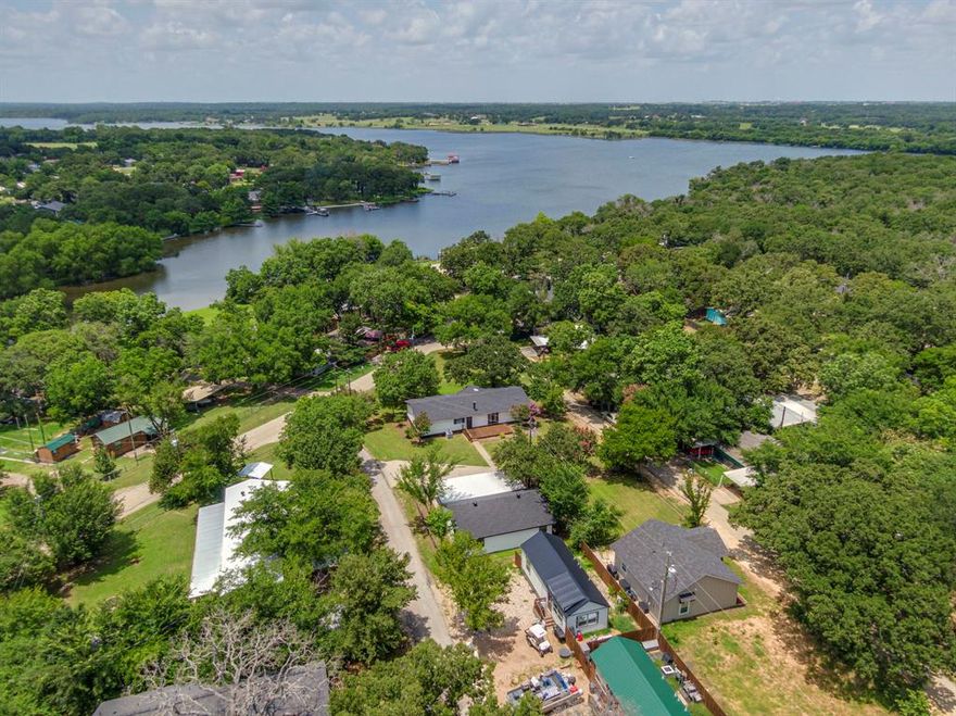 Investor & Handyman Special – Endless Potential on Lake Alvarado!  Located in the revitalizing Blue Water Oaks community, this rare property presents an incredible opportunity with 3 spacious lots and a wealth of possibilities. Whether you choose to remodel the existing home into your perfect lakeside retreat or clear the land to build up to TWO new homes, the options are endless. This property is perfect for resale, rental, or multi-generational living, making it an ideal investment for those looking to capitalize on the growing area.  The community amenities add even more value to this unique property, including:  Private boat ramp & fishing dock for easy lake access, sparkling community pool & playground for family-friendly recreation and on-site trash service & fire department for added convenience and safety.  Whether you’re looking to flip, build, or design your dream lakeside getaway, this property offers tremendous potential in a supportive and flourishing neighborhood.  Opportunities like this don’t come around often—bring your vision, your tool belt, and your offer. The seller is reviewing all offers, so don’t miss your chance to make Lake Alvarado yours!