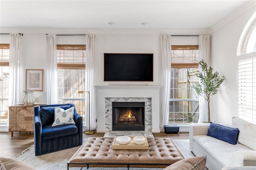 Step inside this beautifully reimagined single-story home where thoughtful design meets effortless livability. Bathed in natural light from oversized windows and a striking central skylight, the open-concept layout seamlessly connects the living, dining, and kitchen spaces, creating an inviting atmosphere perfect for both everyday living and entertaining.

The chef-inspired kitchen is the heart of the home, featuring sleek quartz countertops, updated appliances, a gas range, and clean, timeless finishes that balance form and function. The adjacent dining space flows gracefully into the spacious living area, complete with a refined fireplace and tailored design details throughout.

The private primary suite offers a true retreat, with an expansive bedroom, generous walk-in closet, and a spa-like bath showcasing dual vanities, a freestanding soaking tub, and a separate glass-enclosed shower.

Outside, the fenced backyard offers a private setting ideal for pets, play, or quiet evenings under the Texas sky.

A rare combination of timeless style, smart updates, and single-story convenience, this home is move-in ready and designed to be lived in beautifully.