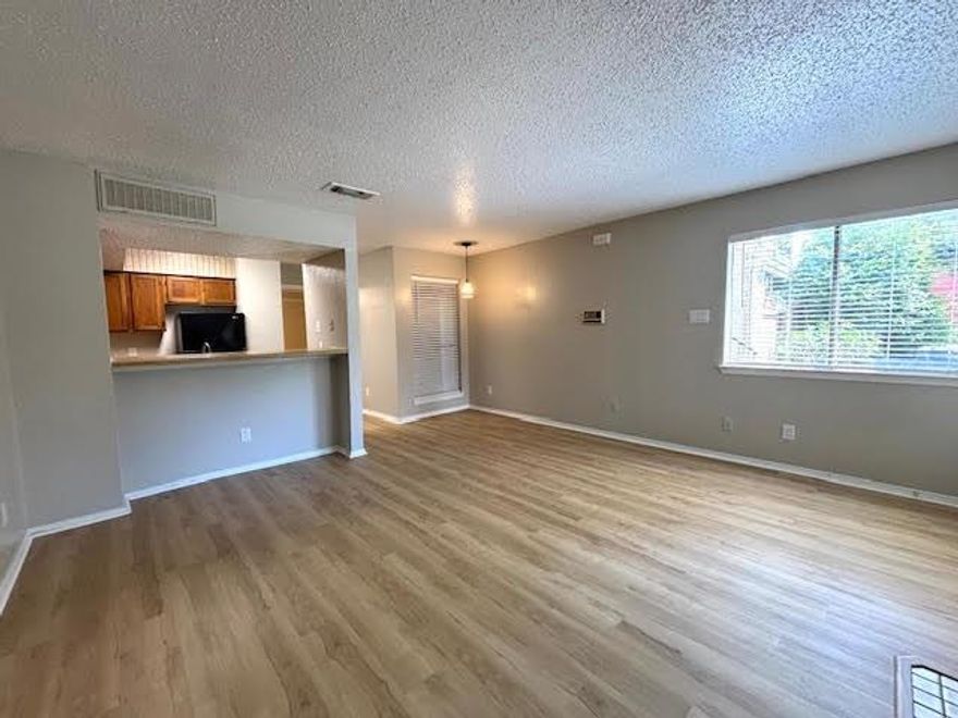 Renovation complete, this 1st floor condo has had extensive updates to include brand  new HVAC systems, new light switches & plugs with matching faceplates give a nice finished look throughout! Elegant light oak style luxury vinyl flooring & on trend lighting create a feel of newer construction at a fraction of the cost!! The kitchen opens  to the living area via serving bar and features an electric range,built-in microwave, a new dishwasher and a refrigerator that conveys! In the bedroom there is a wall of closets and an ensuite bath with a double sink vanity, washer & dryer,  plus a separate water closet. Parking includes one reserved space and tons of visitor parking. Come be the first to live in this condo after the updates!