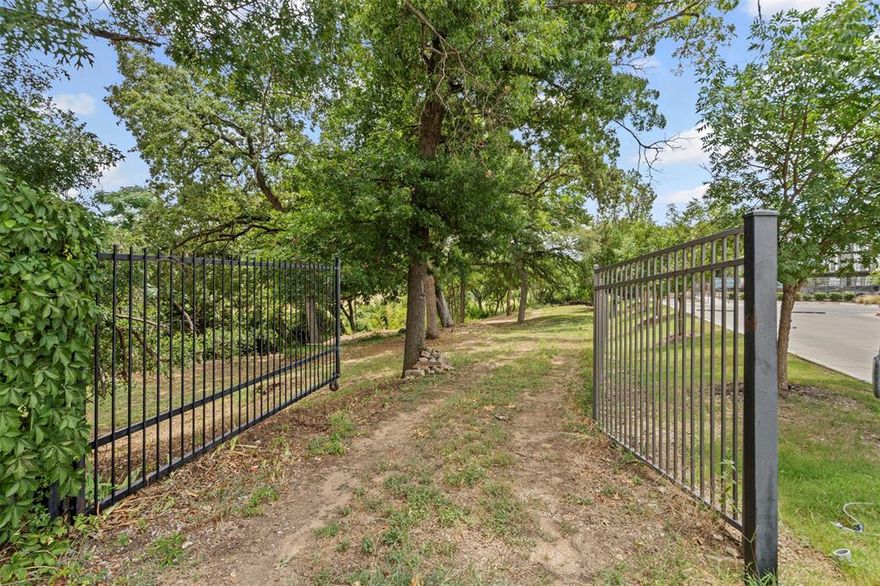 Located in the heart of the booming, thoughtfully developed River District, a rare .673 acre Trinity Riverfront lot offers privacy, mature trees, and direct access to over 100 miles of scenic trails. The land across the river is protected green space with views of beautiful rolling hills of grass and trees. With .673 of an acre to work with, there’s ample room for your dream home, outdoor living spaces, and a backyard oasis designed to take full advantage of this unmatched location. At the edge of the property, all you hear are birds and the water rushing over the weir—pure nature in the heart of the city. Just minutes from downtown Fort Worth, the Cultural District, and the River District’s own growing collection of acclaimed restaurants, boutique shops, and entertainment, walk to local favorites like Heim BBQ and Salsa Limón. Ready for your dream build—plat, survey, topographical survey, geotechnical report, and two site plans are already complete. Bring your vision, your builder, and make every day feel like a retreat. Where the city fades and nature takes over.