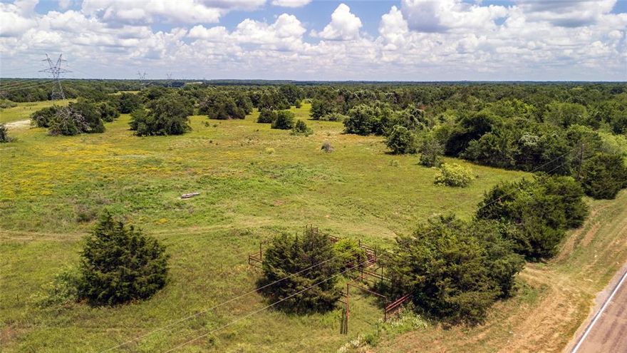 Seller Finance is available. This 10-acre tract of land, ideally situated just 10 minutes south of Wortham and a mere 20 minutes from Corsicana offers the ultimate blend of convenience yet is close to several stunning lakes and the city!  It is one of several that are currently available. With no deed restrictions, a new 4-inch water line and water tap fees have been paid, saving you thousands, the possibilities are endless—whether you're envisioning a large homestead, a weekend retreat, or an investment opportunity. The lush, green landscape is a blank canvas awaiting your vision. The mature trees provide a picturesque backdrop, while the open spaces offer ample room for building, farming, or recreational activities. Enjoy the peace of rural living without sacrificing accessibility to nearby towns and amenities. Photos are of the entire property.
