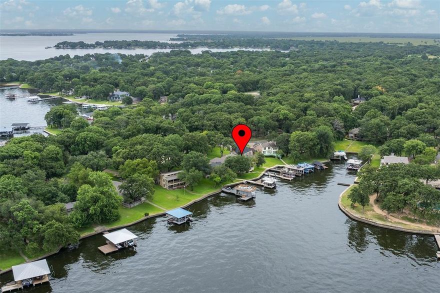 Stunning Austin Stone Lakefront Home in Gated Beachwood Estates!
Move-in ready just in time for summer—even some of the furniture conveys with an acceptable offer! This beautifully designed 4-bedroom, 2-bath custom home sits on a premium waterfront lot in the exclusive, gated community of Beachwood Estates on Cedar Creek Lake.
Perfect blend of comfort,charm, and unforgettable water views and beautiful sunsets. This home is ideal for weekend getaways or full time living. Step out to your private dock and enjoy boating ,fishing or Jet skis , and dont forget about those sunset cruises right from your backyard!
Crafted with unmatched quality, this home features an all-stone exterior—no wood or siding to maintain—and commercial-grade ductwork. Step inside to an open-concept design that seamlessly integrates the living, dining, and kitchen areas, all bathed in natural light from floor-to-ceiling windows showcasing breath-taking lake views. High ceilings and expansive windows create an airy, inviting atmosphere ideal for both relaxing and entertaining.Outdoor living is just as impressive: enjoy a 12-person saltwater Gunite spa, with a 500-gallon buried propane tank, plus an outdoor kitchen with a top-of-the-line TEC infrared grill. The living area flows seamlessly into a gourmet kitchen and out to a sprawling backyard that invites you to relax, entertain, or simply soak in the view.
Highlights include:
Expansive deck and covered patio for outdoor dining and lounging
Private boat dock with lifts for your boat and jet skis


The custom-built boathouse features a structural steel I-beam frame, party deck, heavy-duty boat lift, and three jet ski lifts—a lake lover’s dream!

Additional highlights include:                                          
- Convenient central vacuum system
- Stainless steel lintels over all windows
-Community amenities in Beachwood Estates


Don’t miss this rare opportunity to own a turnkey, lakefront retreat ready for summer fun!