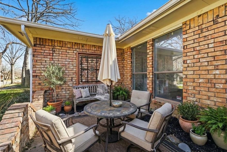 Adorable home nestled in the highly sought-after Overland Stage Estates, featuring a quaint front courtyard with a cozy sitting area—an ideal spot to enjoy your morning coffee or unwind in the evenings. Don’t let the square footage fool you; this home is exceptionally well designed with an efficient layout and no wasted space, creating a warm and inviting feel throughout. The spacious living area features a striking brick fireplace, vaulted ceilings, skylights, wood floors, and exposed wood beams, and flows seamlessly into the kitchen with a breakfast bar and cozy breakfast area. A flexible dining space provides the perfect option for a home office, playroom, or additional living area. This rare four-bedroom floor plan includes large bedrooms with walk-in closets and two full baths—both bathrooms have been recently updated. Additional improvements include a water heater replaced in 2023, along with fresh paint and stylish accents throughout the home. The oversized backyard is ideal for outdoor enjoyment, featuring a flagstone patio and plenty of shaded yard space. An amazing DFW location offers quick highway access and is close to abundant shopping and dining options with easy I-20 access, nearby The Parks Mall and Cliff Nelson Recreation Center. Situated on a spacious wooded lot, served by Martin High School, this home is a must-see!