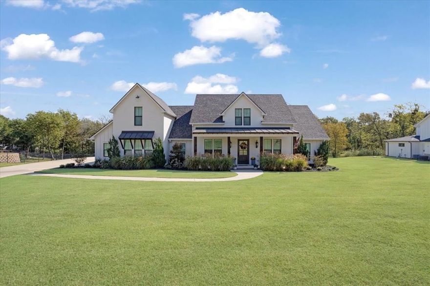 Absolutely stunning custom home on just over one acre! Conveniently located near FM 1417, TX-56, and Sherman High School, this immaculate property is ready for a new family to call it home. The sprawling front yard leads to a wide front porch with tasteful landscaping and tall wood columns. Walking inside you are greeted by high ceilings, open floor plan and large windows with tons of natural light. Dining room off the entrance has decorative lighting and coffered ceiling. Step into the living room with a centered brick fireplace, built-in shelving and tall transomed windows overlooking the backyard. The kitchen boasts a large butcher-block island with expansive bar seating and farm sink. Adjacent to the kitchen is your own butler's pantry with built-in cabinets and a spacious walk-in pantry. Primary bedroom features large en suite bathroom with separate vanities, separate shower and large walk-in closet that leads into the laundry room. The east wing of the house features three bedrooms - one with an ensuite full bath with large walk-in shower and walk-in closet, and the other two bedrooms adjacent to a hallway full bathroom with dual sinks and separate water closet room. In addition to two walk-in attic spaces with plenty of storage, the upstairs features a fifth bedroom with full ensuite bath, but the space could easily be used as an office, media room, play room, or exercise room. Flexible uses! Step out to the expansive back porch with seating area and outdoor counter prep area with sink and built-in cabinets. The backyard is spacious and home to several shady trees, while still having plenty of room to roam (or add a pool!) This beautiful property is tucked away on Ridgeview Rd while still being the perfect convenient location just minutes from downtown Sherman. Don't miss seeing this stunning home! Call your favorite Realtor and schedule your viewing today. *Please note that boundary lines in photos are approximate. Survey is available.*