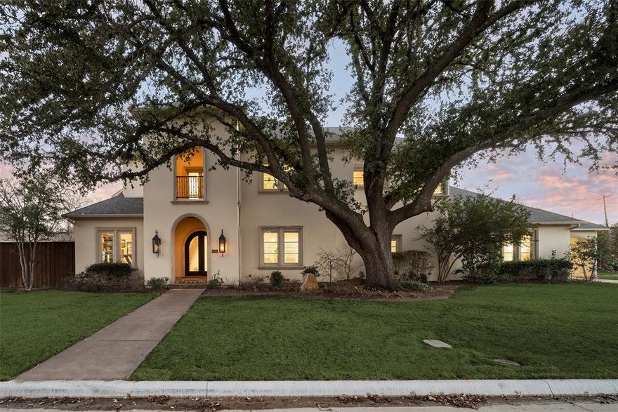 Welcome to 6504 Joyce Way, a Mediterranean-inspired home nestled in the highly sought-after Preston Hollow, set on a meticulously landscaped corner lot. This light-filled open floor plan offers the ideal spaces for seamless indoor and outdoor living and entertaining. The main floor boasts a well-appointed office with custom built-ins, an elegant formal dining room with a butler’s pantry, and a spacious open-concept den with a fireplace, all overlooking the backyard. The gourmet kitchen is a chef's dream, featuring quartz countertops, double ovens, dual dishwashers, and a charming breakfast nook. The oversized primary bedroom, with French doors leading to the backyard, includes a luxurious bath with double vanities, a soaking tub, a separate shower, and an expansive walk-in closet. Additional highlights on the first floor include a guest bedroom, wine storage, and a utility room. Upstairs, enjoy a game room, a front balcony, and three en-suite bedrooms with generous closet space. The backyard is truly an oasis, offering a cozy fireplace, turfed yard, and a heated pool and spa. Ideally located near prestigious private schools and shopping and dining at Preston Center and Preston Royal shopping centers, this combines convenience and luxury in a premier setting.