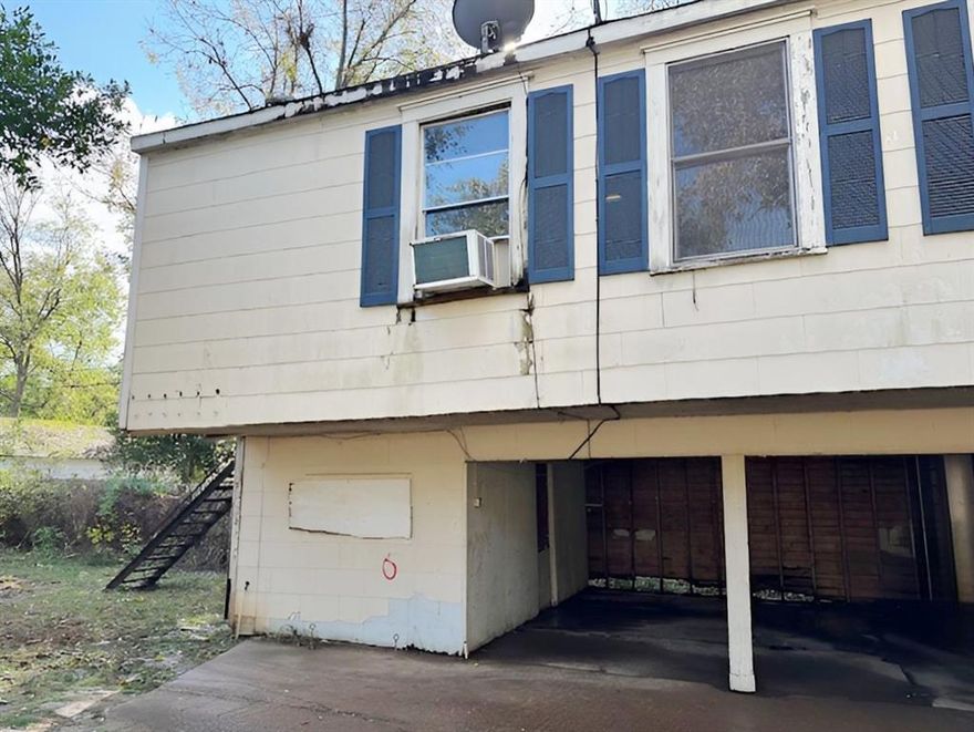 This property was a duplex house with an address of 647-649 Kirby Place and a detached garage apartment with an address of 651 Kirby Place at one time. The duplex had a large tree fall on it and had to be torn down. This property is now mostly vacant lot but with a free standing 2 car garage that has a 1 bed, 1 bath apartment above it. The tax record still shows the address as 647 Kirby but the apartment has the address of 651 on the outside. The garage apartment is in average condition and could be rented out or lived in while a new house is being built on the lot.