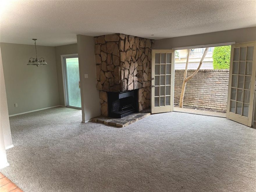 Perfect an Investor or first time buyer! Welcome to the gated community of Park Lane Place. This ground floor 3 bed, 2 bath condo is ready for a new owner's final touches. The unit has and open floor plan with plenty of natural light in every room! Recent updates include new carpet in bedrooms, fresh paint throughout and new kitchen countertops. The primary bedroom has a walk in closet and full ensuite bathroom. The additional bedrooms can be used as an office or guest rooms. There is a gorgeous corner built-in wood burning fireplace in the living room with french doors leading out to a large private patio area that extends around the side. There is also an secondary patio entrance through the eat in dining area. Come see this amazing condo! Conveniently located near major highways, shopping and dining. Motivated Sellers Bring your offers! Condo is being sold As-Is. Owners are unable to make any additional repairs.