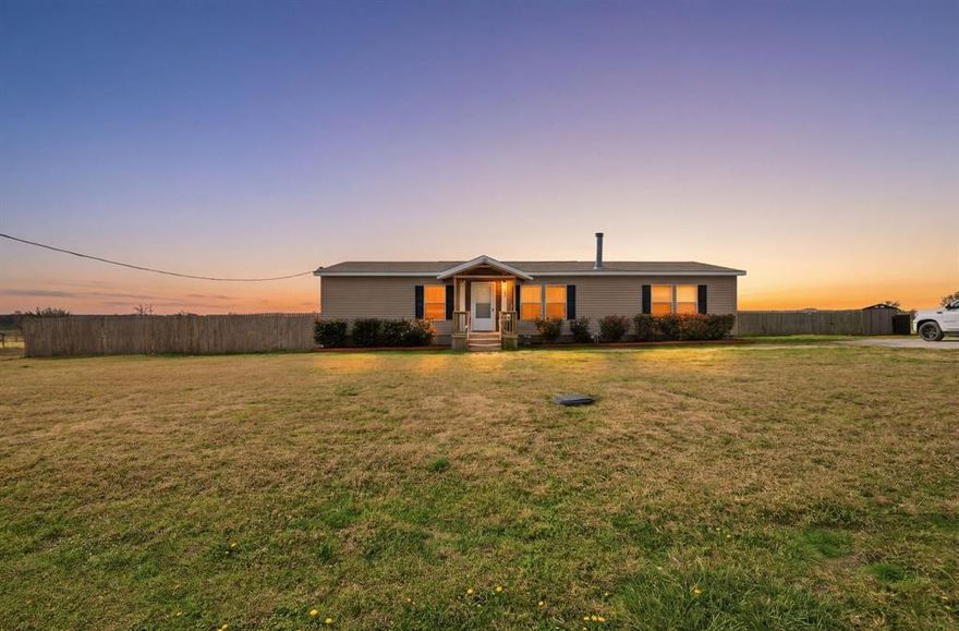 Escape to the quiet charm of country living with this beautifully updated home situated on 3.23 acres in Grayson County. Located on a paved county road just outside Whitesboro, this property offers the peaceful lifestyle of rural living while still providing convenient access to town.

The 4 bedroom, 2 bathroom home has been recently refreshed with new carpet in all bedrooms and the living room, along with freshly textured and painted walls throughout. The spacious kitchen is designed for gathering, featuring custom cabinetry, updated countertops, abundant storage, and plenty of room for family and friends to come together. A cozy wood burning stove anchors the living room, creating a warm and inviting space to relax.

Step outside to enjoy the covered back patio overlooking the fenced and cross fenced acreage, ideal for animals, gardening, or simply enjoying wide open views. The property includes a pond and backs to an open field, offering a peaceful setting and added privacy.

Additional improvements include a detached two car garage or shop with electricity and a garage door opener, two separate entrances to the property, and a rustic barn suitable for animals, equipment, or storage. With no known restrictions, paved road access, and plenty of usable acreage, this property offers the flexibility to enjoy country living exactly the way you want.

Buyer and buyer’s agent to verify all information.