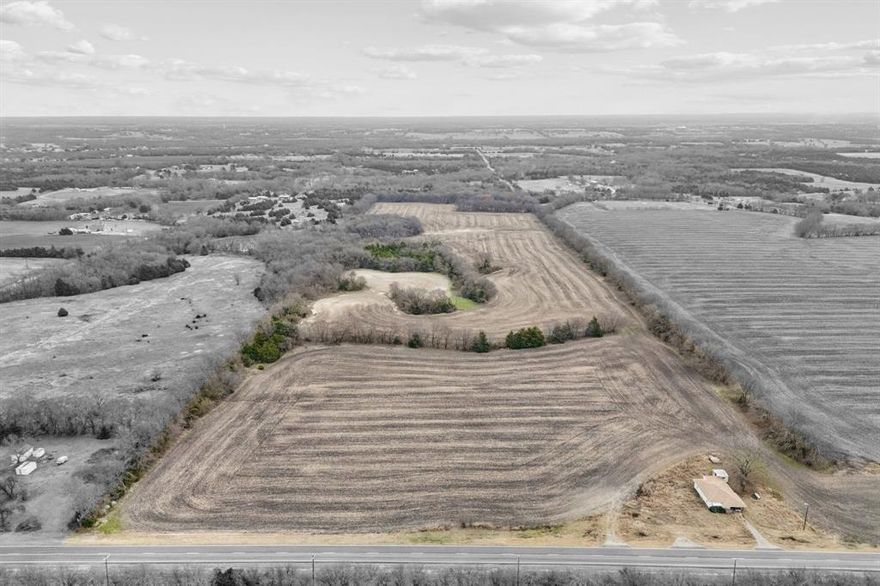 Prime 51 acre tract in Anna, Texas, offering a rare combination of productive land, natural features, and strategic access in a rapidly growing North Texas market. The property consists of a desirable mix of open crop fields and native wooded areas, providing both usability and scenic appeal. Currently Ag exempt, allowing for significant property tax advantages while held for agricultural use or land banking. With road frontage and access from two separate roads, the tract offers excellent flexibility for multiple entrances, phased development, or potential subdivision, subject to zoning and city approvals. This property is well suited for a variety of uses including farming, ranching, recreational use, or as a strategic long-term investment. Its location in Anna places it within one of Collin County’s fastest-growing corridors, with increasing demand for residential and mixed-use development while still maintaining a rural setting. An exceptional opportunity for investors, developers, or owners seeking to scale, build, or speculate in the high-growth area of North Texas. Roughly 8 Minutes to the brand new local WalMart in Anna and 16 minutes to the HEB & Buc-ee's. Also only about 45 Minutes to downtown Dallas, less than 20 minutes to major shopping centers, and medical needs. Drone video tour available upon request.