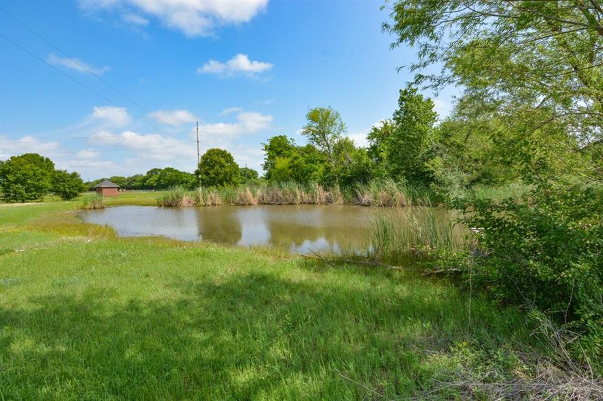 The perfect spot for your dream home! 5 fully fenced acres with beautiful mature trees, some pasture and a large pond. Plenty of room to build! Property includes a well and meter box in desirable neighborhood!