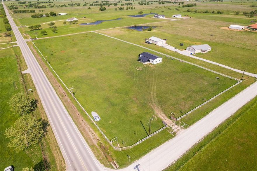 Gorgeous 5 acre lot ready for your new home or barndominium! This acreage is a very desirable corner lot , Fenced off and gated ! Running electricity and water already established at the property site !  Brand new 1,800 sqft shop with 3 rollup doors , as well as a covered patio area ! just a few minutes away from hwy 35, 10 min drive to lake Ray Robert’s , 5 min drive to downtown valley view , and a 15 min drive to Winstar world Casino . Perfect Location for multiple reasons! Plenty of stunning new builds around the area as well as some stunning ranches ! Minimal Restrictions ( NO MOBILE HOMES )