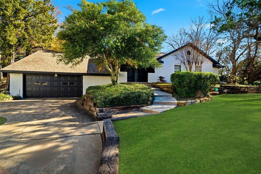 Dynamic split level home, with upgrades throughout the property, located in Cedar Hill, TX, burrowed in on a secluded .49 acre lot, with curb appeal! Upgrades include outdoor kitchen and patio, with built-in features, Modern finishings, spacious floorplan with large, 25x16 living room with a vaulted ceiling. Kitchen has a built-in desk & a built-in cabinet in the breakfast room. Master bath has a vaulted ceiling, skylight, & flagstone deck enhances the outdoor setting. This property has great views of the secluded backyard! Beautiful waterproof flooring in the living room & kitchen. Smart appliances included, including coffee making refrigerator,  All bedrooms are large with a private study at the lower level that could be a utility room, workout space, office, or 4th bedroom; choose your hobby, Master bedroom with built-in closet, steam shower, and separate tub. Lots of personality in this unique home! LED Lighting throughout the home with dimmers,