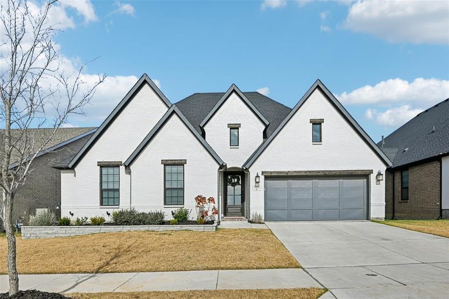 Stunning Coventry-built home featuring an open floorplan and thoughtful upgrades throughout, including wood flooring, upgraded light fixtures and a water filtration system with reverse osmosis. The inviting living room showcases a cozy corner gas fireplace, while the gorgeous kitchen is designed for both everyday living and entertaining with white cabinetry, an oversized island, upgraded granite countertops, double ovens, and a gas cooktop. A private study provides the perfect work-from-home space. Three bedrooms are conveniently located on the main level, including a serene primary suite with dual sinks, an oversized walk-in shower with bench seat, a soaking tub, and a walk-in closet complete with built-in dressers. Upstairs offers a spacious game room, fourth bedroom, and full bath—ideal for guests or additional living space. A functional mud room and large laundry room with cabinetry provide ample storage and keep daily essentials neatly tucked away. Enjoy outdoor living on the extended covered patio, overlooking the low-maintenance artificial turf lawn and your own private putting green for added fun. All of this is complemented by a 3-car tandem garage featuring durable epoxy floors and a Tesla charger. Located in the highly sought-after master-planned community of Pecan Square, residents enjoy resort-style amenities including multiple pools, parks and playgrounds, pickleball and basketball courts, fitness center, co-working space, indoor play area, and year-round community events. HOA fees include internet and full access to all Pecan Square amenities—offering the ultimate work-life balance.