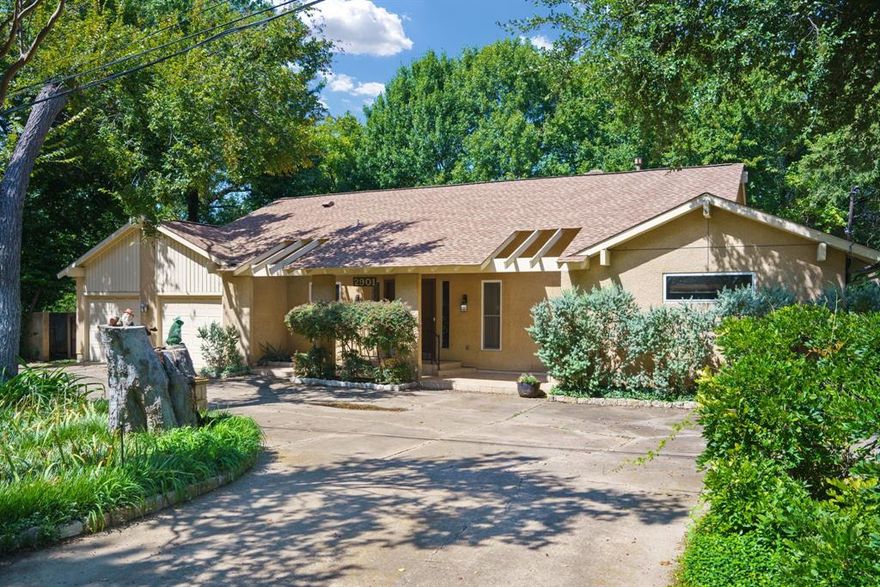 This rare opportunity offers over a half-acre lot overlooking a serene creek with mature trees, creating a private and picturesque setting just off Josey Lane north of 635. The single-level home currently features 3 bedrooms and 3 bathrooms, with the seller having combined two bedrooms into a spacious office complete with custom built-in file cabinets and bookcases, plus a full bath, making it ideal as a home office or in-law suite. The primary suite includes direct access to the back porch, an updated ADA-style bath with a huge walk-in shower, and a unique sunroom-hot tub retreat added by the seller for relaxation and year-round enjoyment. Windows and sliding glass doors have been replaced with high-end double-pane upgrades for efficiency and comfort. While the home offers great functionality and potential for personalization, the lot itself is the true highlight, surrounded by nature and enhanced with terracing down to the creek, complete with gabions installed for erosion control now adorned with lush vines. Whether you choose to remodel, expand, or build your dream home, this property presents incredible possibilities in a small, exclusive neighborhood of large lots where new high-end construction is selling for over $2 million. The home is not in a floodplain, with FEMA maps available in the transaction desk, and its prime location provides quick access to both 635 and 35 for convenient commuting. This is an outstanding chance to create your vision in one of the area’s most desirable settings.