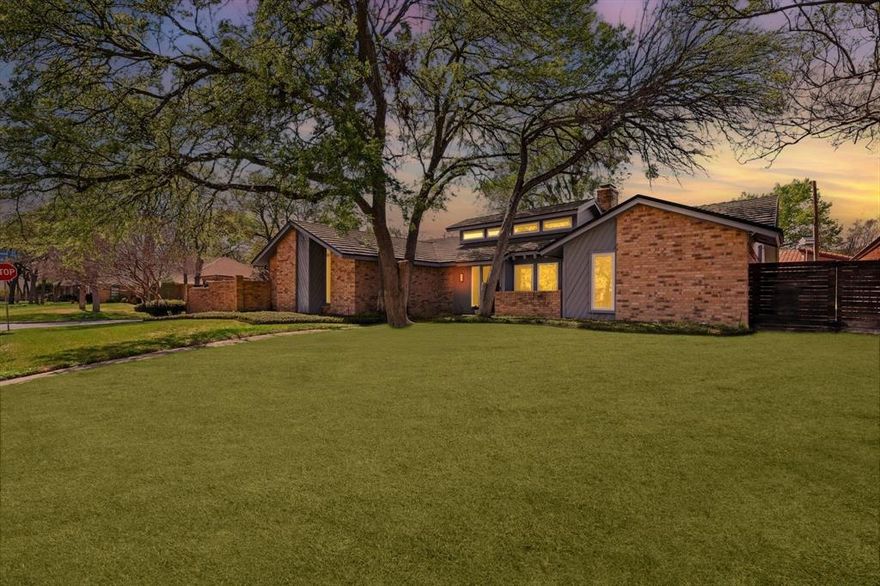 Beautifully updated single-story home in the heart of DFW, just minutes from the Arlington Entertainment District, major stadiums, Six Flags, and TX Live—with **no HOA** and zoning to highly desired Lamar High School. Situated on a prime oversized corner lot within a quiet cul-de-sac, this property is surrounded by mature shade trees in an established neighborhood. The home immediately stands out with striking curb appeal, blending clean modern lines with distinctive mid-century flair.

Inside, a bright open-concept layout seamlessly connects two expansive living areas, creating an ideal space for both everyday living and entertaining. The kitchen is centrally located and thoughtfully designed with granite countertops, stainless steel appliances, and a functional layout, while a nearby breakfast nook easily serves as a flex space or home office. Custom features throughout include a dramatic floor-to-ceiling brick fireplace, built-ins, transom windows, and vaulted ceilings that fill the home with natural light.

Designed with a desirable split-bedroom floor plan, the layout offers added privacy with the primary suite set apart from the secondary bedrooms. The spacious primary retreat features private side yard access to the pool area and an oversized ensuite bath with a separate seamless glass shower, dual closets, and a bright, airy feel.

Step outside to enjoy two separate backyard spaces—one retreat for quiet relaxation, the other an entertainer’s dream with a sparkling pool and covered patio, perfect for hot Texas summers. Both areas offer exceptional privacy for hosting or unwinding.

With generously sized bedrooms, thoughtful design, and meticulous upkeep throughout, this move-in ready home delivers comfort, style, and an unbeatable location.