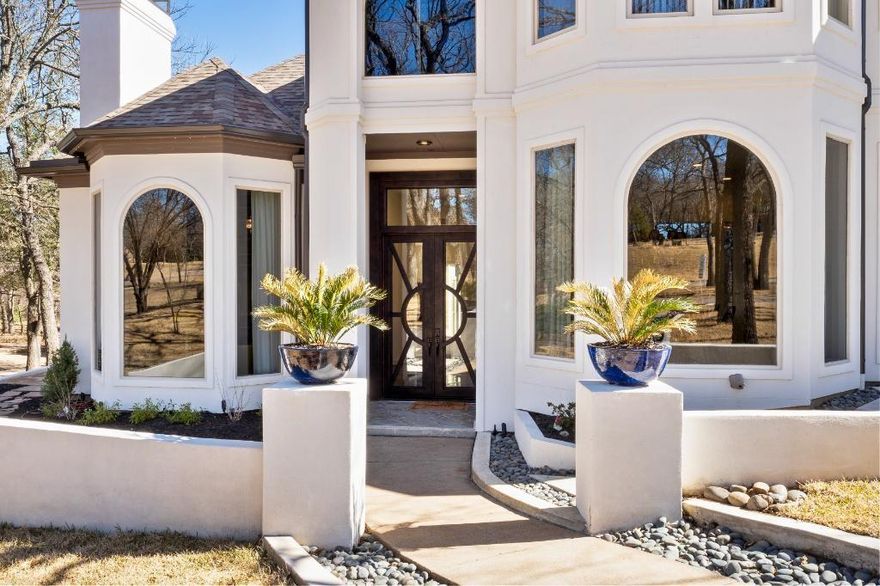 This gorgeous Mediterranean  home offers a full 1.1 acre, backs up to the Army Corps of Engineers. Complete with hiking trails to the Lake Grapevine shores, offers abundant wildlife encounters. A listing that stops you in your tracks it is jaw-dropping and completely one-of-a-kind. The foyer renders views of the Living room, dining room and pool.  Outdoor features include infinity pool with waterfall, outdoor kitchen, two gas fire bowls and fire feature, a covered and open-air seating area. There are 5-HVAC units, 2-living spaces, tankless water heater, 2-gas fireplaces, remodeled kitchen, butler’s pantry, subzero refrigerator and the list goes on. This custom rare find will exceed your wildest dreams!