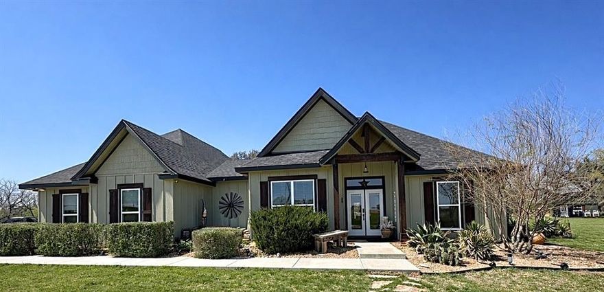 Beautiful 3-bedroom, 2.5-bath home offering approximately 2,000 sq ft on ~2.5 scenic acres.

Inside, you’ll find stained concrete floors, a vaulted living room with a custom linear fireplace, and a spacious kitchen featuring a 7’ island with custom granite countertops. The primary suite includes a spa-like bath with a 6’ walk-in shower, rain head, wall mount, and handheld fixture.

A bonus room or office with custom 8’ barn doors adds flexibility, while the fully insulated, climate-controlled garage features custom cabinetry and its own half bath.

Outdoor living shines with an 800 sq ft covered patio and outdoor cooking area, plus a custom 6’ stone fire pit with seating for eight. The property is dotted with mature oak, peach, and mesquite trees and includes a floating dock, fishing platform, and a 10x16 shed. Seller will leave furnished with an acceptable offer.