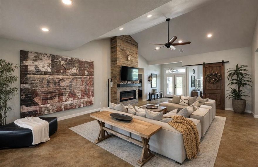 Beautiful 3-bedroom, 2.5-bath home offering approximately 2,000 sq ft on ~2.5 scenic acres.

Inside, you’ll find stained concrete floors, a vaulted living room with a custom linear fireplace, and a spacious kitchen featuring a 7’ island with custom granite countertops. The primary suite includes a spa-like bath with a 6’ walk-in shower, rain head, wall mount, and handheld fixture.

A bonus room or office with custom 8’ barn doors adds flexibility, while the fully insulated, climate-controlled garage features custom cabinetry and its own half bath.

Outdoor living shines with an 800 sq ft covered patio and outdoor cooking area, plus a custom 6’ stone fire pit with seating for eight. The property is dotted with mature oak, peach, and mesquite trees and includes a floating dock, fishing platform, and a 10x16 shed. Seller will leave furnished with an acceptable offer.