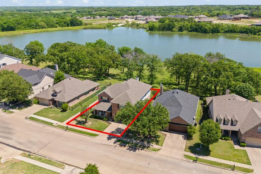 ***New updates to check out!!***
Welcome to this meticulously maintained 5-bedroom, 2.5-bathroom home located in the highly sought-after Mountain Valley Subdivision—a picturesque community offering resort-style amenities including pools, walking trails, basketball courts, frisbee golf, pickle ball,  tennis courts, large pond fishing and kayaking.

Step inside to a spacious, light-filled living room featuring a dramatic floor-to-ceiling stone fireplace and expansive windows that frame breathtaking views of the large pond. The open-concept kitchen is perfect for gatherings, boasting ample counter space, a large eat-in area, and a dedicated dining space for more formal occasions.

The primary suite is conveniently located downstairs and includes a generous en-suite bathroom and large closets. Upstairs, you’ll find four additional bedrooms, a full bathroom, and a spacious playroom— offering more stunning views of the water.

Outside, enjoy a large patio ideal for entertaining or simply relaxing while taking in the most beautiful Texas sunsets.
New AC, New Roof, New Gutters!!!