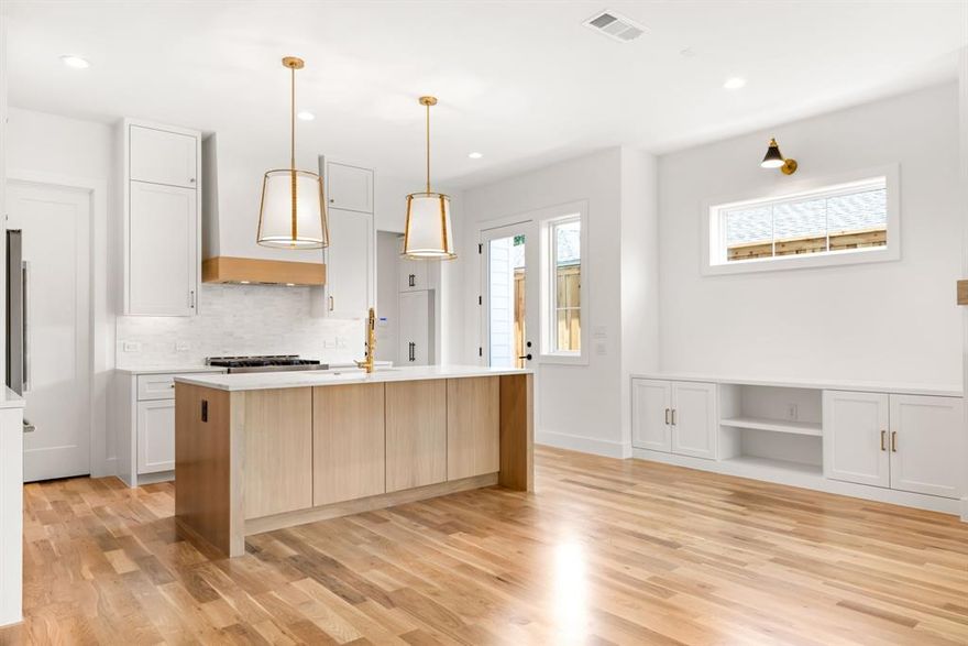 Welcome to 4606 Hopkins Avenue, a luxury new construction duplex offering the perfect blend of open concept living and location. Situated in the heart of Inwood Park, one of Dallas’ fastest transitioning neighborhoods, this 2,780 sq ft 3-bedroom, 2.5-bath and office is a thoughtfully designed living space. Step inside to a gourmet kitchen and downstairs living space featuring high-end finishes, custom built-ins, designer lighting, and a dedicated office, ideal for working from home. Enjoy indoor-outdoor living with an oversized covered patio and a TURFED BACKYARD, perfect for relaxing or entertaining. The second story primary suite is a true retreat with dual walk-in closets and a spa-inspired bathroom designed to impress. Located just minutes from Dallas' best shopping, dining, the Tollway, and Love Field.