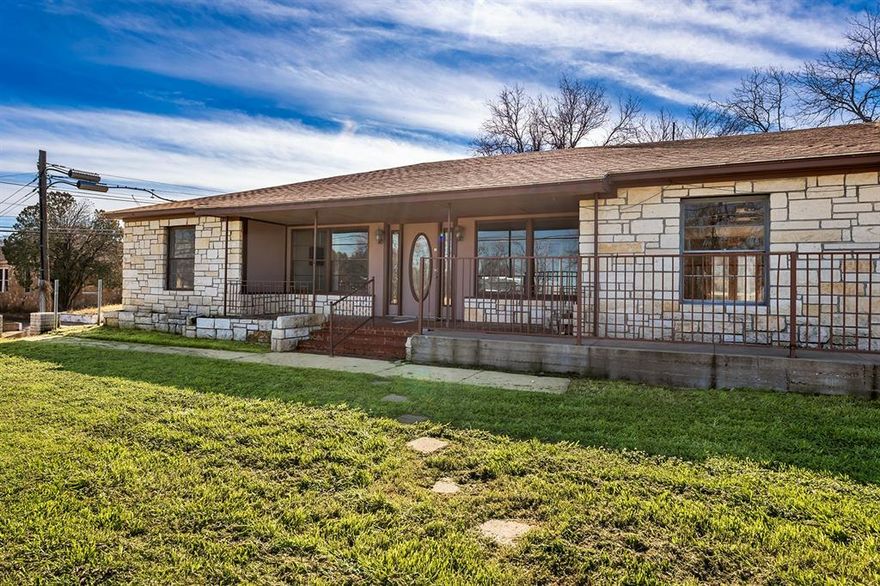 PRIME location with a paved parking lot, this Austin stone building is ready for a fresh, new vision. Nearly 4,000 square feet of potential on 0.46 acres with Hwy 377 S Bridge St. frontage. Zoned COMMERCIAL, This property offers excellent bed and breakfast or multi-family. scenarios with eight private rooms, and six bathrooms with multiple set ups including: two full private baths, three Jack and Jill baths, and a half bath in main living foyer space. This property also includes a full working kitchen with gas range, dishwasher and a large peninsula. To the south of the main building there's a separate, 860 square foot studio type apartment with full bath as well. 
This property offers great, investment opportunity, potential multi-family options - bring your ideas and call for a showing! 325-792-8345