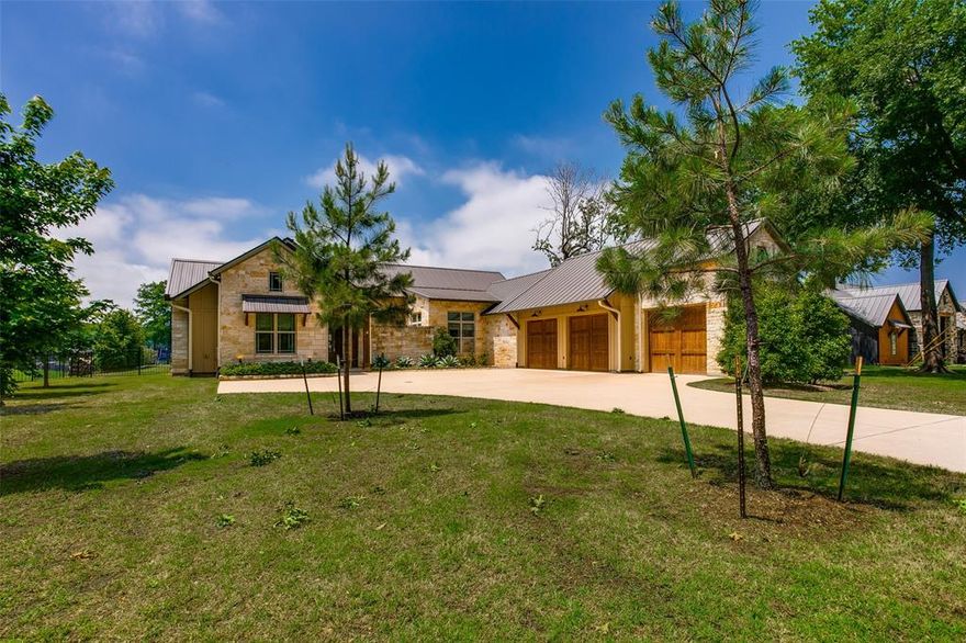 Spectacular landscaped home on Cedar Creek Lake with Tons of upgrades. Hill Country style with stone exterior and standing seam metal roof. Solid hardwood floors throughout and large masonry Fireplace .Double glass front doors invite you into the large open plan Living and Dining room with custom built in cabinetry and Gourmet Kitchen with large island and gas cook top, adjacent to the kitchen is a walk in pantry and butlers pantry area with wine fridge. Large covered porch with upgraded electric screened blinds throughout creating another living area with built in grill. Custom Bunk room sleeps four with its own bathroom. Two secondary bedroom with shared bathroom. Master suite on the other side of this home with direct access to the pool with ensuite and huge double closet. Separate laundry room with sink and door to outside access. Oversized garage with golf cart space.Large heated pool with water feature and spa and fire pit for evening entertaining. Boat house with party deck.