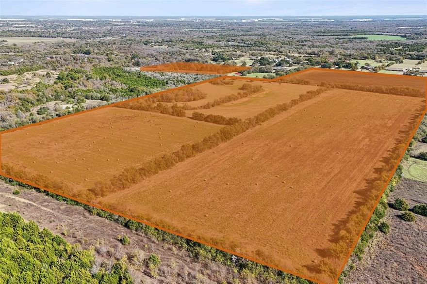 Positioned for near-term development! An exceptional opportunity awaits with this highly desirable 91.74-acre property located in the heart of Lancaster, just off Highway 35E. Currently ag-exempt, this versatile parcel offers limitless possibilities, from residential development to creating your dream commercial project, ranch, or private estate. The property features utilities on-site and is surrounded by picturesque tree-lined borders, providing a serene and secluded setting. Positioned across the street from other large homes and estates, this prime location offers both convenience and prestige. With its unmatched potential and ideal setting, this property is a rare find that invites you to bring your vision to life.