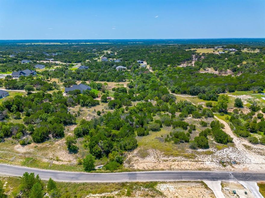 Welcome to your dream homesite in the highly desired Eagles Bluff gated community! Nestled 2.184 acres, this property offers the perfect blend of peace, privacy, and natural beauty being backed up to a creek! Enjoy breathtaking views of the rolling Texas hills and mature and heavily treed topography. Located in a great spot within the neighborhood, you’ll appreciate the quiet atmosphere while still being part of an active, friendly community. Shops are allowed, giving you the flexibility to create the space you need for hobbies or storage. While larger animals are permitted on parcels over 4 acres, you’ll still have plenty of room to enjoy the outdoors with both shop and pool opportunities! Families will love being in a top-rated school district, making this an ideal place to build your forever home. The property requires a well and septic system, giving you the opportunity to design your utilities to suit your needs. Bring your own custom builder. SF minimums apply. Deed restrictions available. Experience the best of Texas living—peace, tranquility, and a welcoming community—all within Eagles Bluff! Adjacent lot available also to have a combined total of 4.247 acres!