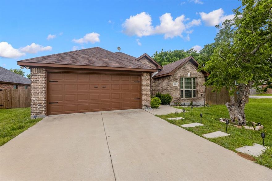 Charming starter home in Palmer, Texas—where comfort, style, and value come together. This beautifully maintained traditional brick home, built in 2020, offers 3 bedrooms, 2 full baths, and approximately 1,726 square feet of thoughtfully designed living space on a desirable corner homesite in the Virginia Estates subdivision.

Step inside to a spacious open-concept floor plan filled with natural light, perfect for both everyday living and entertaining. The generously sized living area flows seamlessly into the kitchen and dining space, creating an inviting setting for gatherings. The kitchen is well-appointed with granite countertops, stainless steel appliances, ample cabinetry, a large island, and a breakfast bar—ideal for casual dining or hosting guests.

The private primary suite serves as a relaxing retreat, featuring a walk-in closet with custom organization and an ensuite bath complete with dual sinks and built-in storage. Two additional bedrooms provide flexibility for family, guests, or a home office.

Wood flooring extends throughout the main living areas, with tile in the bathrooms for durability and easy maintenance. Decorative lighting and thoughtful finishes add warmth and character throughout the home. A separate utility room with full-size washer and dryer connections adds everyday convenience.

Step outside to enjoy a large backyard and patio—perfect for entertaining, relaxing, or enjoying peaceful Texas evenings. The fully fenced yard offers both privacy and space to make it your own.

Additional highlights include a 2-car attached garage, no HOA, and solar panels that will be paid off by the seller at closing, offering energy efficiency and long-term savings.  This home delivers the perfect balance of small-town charm and modern convenience.   Inviting all reasonable offers. Will not respond to low-ball offers, offers that include owner finance, or assignments.