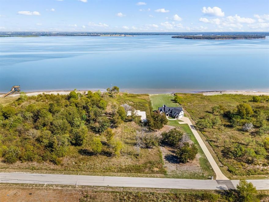 Discover your dream waterfront property at 9397 West Shoreline Dr. in Kaufman County — a rare opportunity to own a beautifully prepared acreage with stunning lake views and exceptional groundwork already complete. This property is fully ready for construction, saving you time and cost. The pad site is built, foundation is laid, and moisture conditioning and grading are already done to perfection. Rough plumbing is complete, ensuring a smooth transition to the next phase of your build.
The lot features a durable steel retaining wall for long-term stability and shoreline protection — a valuable addition for any waterfront investment. Approved architectural plans and detailed renderings are included, giving you a clear vision of the elegant home that can soon rise here.
With its peaceful surroundings, open acreage, and direct water access, this property combines natural beauty with practical readiness — the ideal blend for building your forever home or a luxury retreat. Opportunities like this, where nature meets preparation, are truly rare in Kaufman County.
Make your lakefront living dream a reality — the groundwork is already done; all that’s missing is your finishing touch.