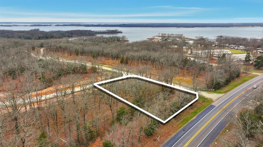 GATED LUXURY LOT NEAR LAKE FORK! 0.73 Acres — Gated Community — Fisherman's Bay Subdivision — Underground Utilities — Quitman ISD — Minutes to Lake Fork. Build on your homesite lot, then enjoy Lake Fork via an additional lot included with the property that offers waterfront access. Located within the exclusive Fisherman's Bay, this strategically positioned lot offers exceptional potential for buyers seeking a custom estate home or a weekend retreat in a premier lakeside community. The land is partially wooded and level, providing a serene setting with mature trees and a private feel ideal for custom residential builds. Residents enjoy access to community facilities and a private boat ramp, making it a world-class destination for bass fishing and outdoor recreation. Conveniently located near Quitman schools and local infrastructure, this property presents an excellent opportunity for high-end residential living in a rapidly growing area. Buyer to verify utilities, HOA restrictions, survey, and building requirements.