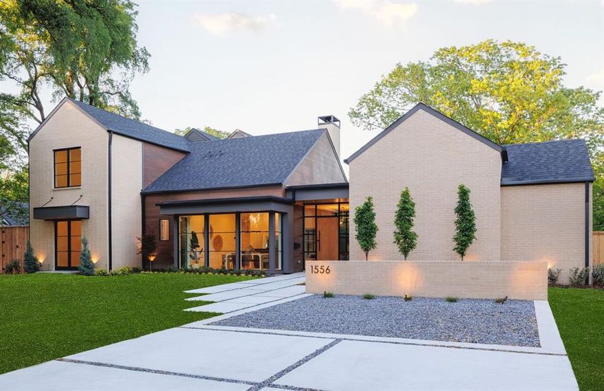 Nestled in the tranquil neighborhood of Casa Linda Estates - with oversized lots, wide, curvy streets and hundred year old trees - lies a newly built masterpiece that makes a statement from the moment you round the corner. Every inch of this home has been carefully crafted and thoughtfully executed and you will feel it immediately upon stepping inside. The entryway has floor to ceiling windows, offering picturesque views of the backyard. You’ll find that same effect throughout the downstairs living space. An abundance of windows providing natural light, high ceilings and a flow through rooms that makes it feel wide open, yet each space has its own unique feel. It’s the designer details and finishes that really make this house stand out. The living space flows effortlessly into the kitchen, complete with custom built cabinetry, premium appliances, a scullery, walk-in pantry and separate bar. A breakfast nook looks outside to the covered porch, while the formal dining room at the front of the house makes for a perfect setting for entertaining guests while the sunset casts a golden glow. Also downstairs on its own wing is the primary suite and bath, including a spacious double vanity, free standing tub and separate shower. On the other side of the home, behind a jib (hidden) door in the kitchen, is a dedicated office and a guest room with an ensuite bathroom, to provide peace and privacy. Upstairs has plenty more space to spread out. A huge secondary living space, small room for a gym or hobby area, and an additional three bedrooms and bathrooms and a laundry room that even has its own unique designer touches. The corner lot is grand, and the private backyard has a 8’ fence with electric gate, covered porch with built-in fireplace and gorgeous landscaping. Just over a mile to White Rock Lake, the Arboretum and dozens of shops and restaurants, this location offers peaceful surroundings with quick access to all that East Dallas has to offer.