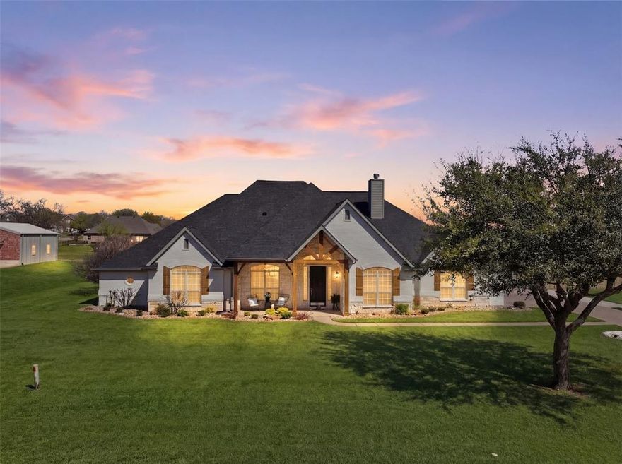 Experience the perfect blend of luxury, space, and lifestyle in this fully renovated home on nearly an acre in one of Joshua ISD’s most sought-after neighborhoods. From the resort-style pool to the flexible layout and dual primary suites, every detail is thoughtfully designed for how you live and entertain. This stunning 5-bedroom, 4-bathroom home offers over 3,400 square feet of curated living space on just under an acre in a premier Joshua ISD community—recognized among the top-rated districts in DFW. Blending modern upgrades with timeless design, the home delivers both sophistication and functionality. Inside, you’re welcomed by soaring ceilings, abundant natural light, and wide-plank flooring throughout. The versatile layout includes a dedicated office plus an additional flex space ideal for formal dining or a second workspace. The open-concept living area flows seamlessly into a beautifully appointed kitchen featuring a large island, farmhouse sink, designer lighting, custom cabinetry, and premium countertops—all anchored by a warm, inviting living space with a fireplace.
The home features two primary suites, offering flexibility for multi-generational living or private guest accommodations. The main suite is a true retreat with a spa-inspired bath, complete with a freestanding soaking tub, oversized walk-in shower, and dual vanities.
An expansive gameroom with bar provides the perfect setting for entertaining or relaxing.
Outdoors, the property transforms into a private retreat. The fully renovated saltwater pool with water feature is complemented by an expansive patio, covered outdoor living area, and pergola with multiple seating spaces—ideal for gatherings or quiet evenings. The nearly one-acre lot offers a rare combination of privacy, scale, and potential.
With designer finishes, a move-in ready presentation, and an exceptional setting, this home represents a rare opportunity to own refined living with acreage in Joshua ISD.