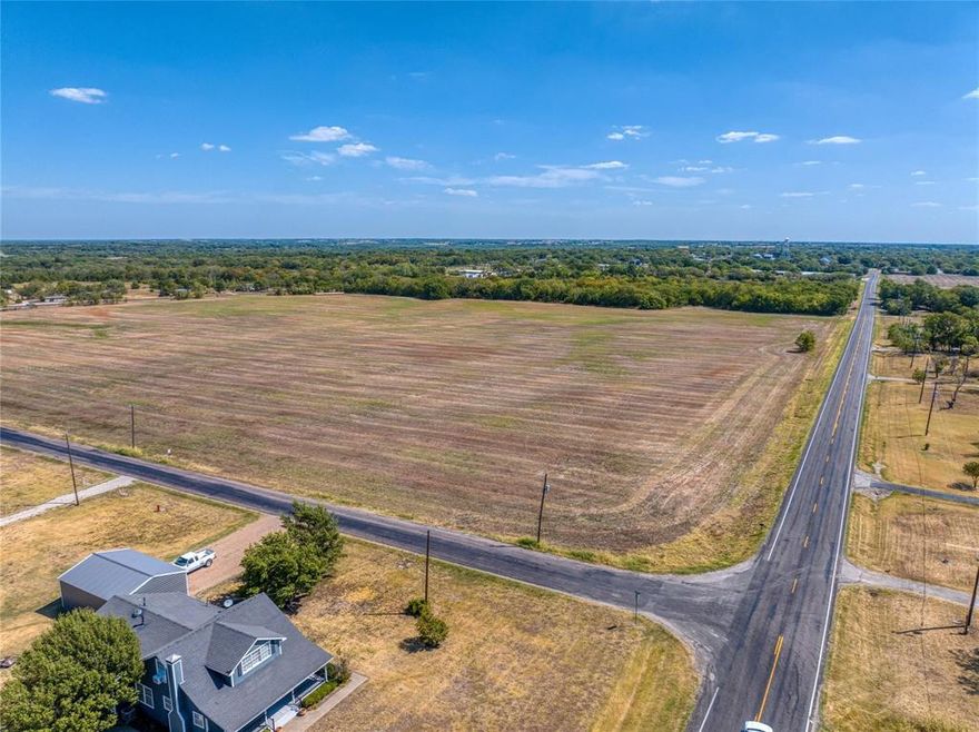 Outstanding opportunity to acquire 36.30 acres within the city limits of Tom Bean. Water and sewer services are available in close proximity to the site, which is located less than half a mile from Tom Bean High School. The acreage has the potential to be subdivided into larger lots for residential development or can be maintained under the current agricultural assessment, benefiting from a favorable tax rate. The property is zoned SF-E and is situated within city limits. Excellent for long-term investment or development, This property is bordered by two roads, providing approximately 1,565 feet of frontage along FM 902 and an additional 990 feet along Joe Bob Ln. The land is positioned just south of Hwy 11 and is conveniently a 10-minute drive from Hwy 75, 7 miles from HWY 75. Currently, the property is zoned as SF-E (single family estates). The topography is gentle, and according to FEMA maps, there is no floodplain on the property. A recent survey is available.