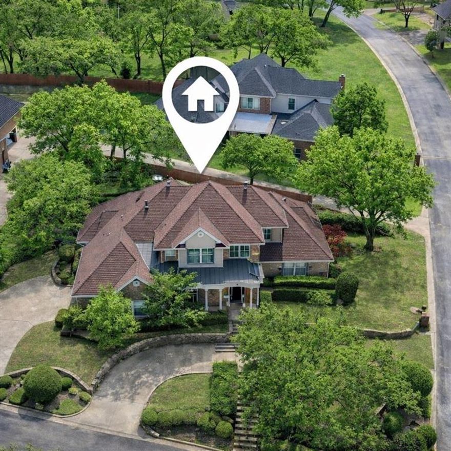 Timeless charm meets everyday functionality in this stately home located in Bay Club along the shores of Lake Arlington. Grand entry with soaring ceilings, wood floors, custom millwork, welcomes you into multiple living and dining areas ideal for entertaining. The spacious kitchen featuring premium Viking appliances and a large island opens seamlessly to the main living space. Light filled sunroom offers the perfect spot to relax, unwind, or enjoy morning coffee year-round, The private primary suite is located on the main level and features dual vanities, a walk-in shower, and garden tub. Flexible secondary bedrooms provide space for guests or a home office. Enjoy outdoor living on the elevated deck, ideal for entertaining or peaceful evenings outdoors. Bay Club is an active community offering tennis, pickleball, a private clubhouse, and a boat dock. Don't miss the opportunity 
to experience this exceptional home and the Bay Club lifestyle in one of Lake Arlington’s most desirable, gated lakeside communities.