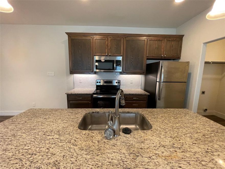 Stunning 3 bedrooms and 2 bathrooms Duplex Home. GREAT Ft Worth Location, SPARKLING Stainless Steel Appliances and Granite Countertops. Beautiful Hardwood Look Tile flooring. Open Gourmet Kitchen plan connected to the living Room. Full Size Washer and Dryer Connections. Spacious Pet Friendly Wood Fenced Yard. Attached are two Car Garage.