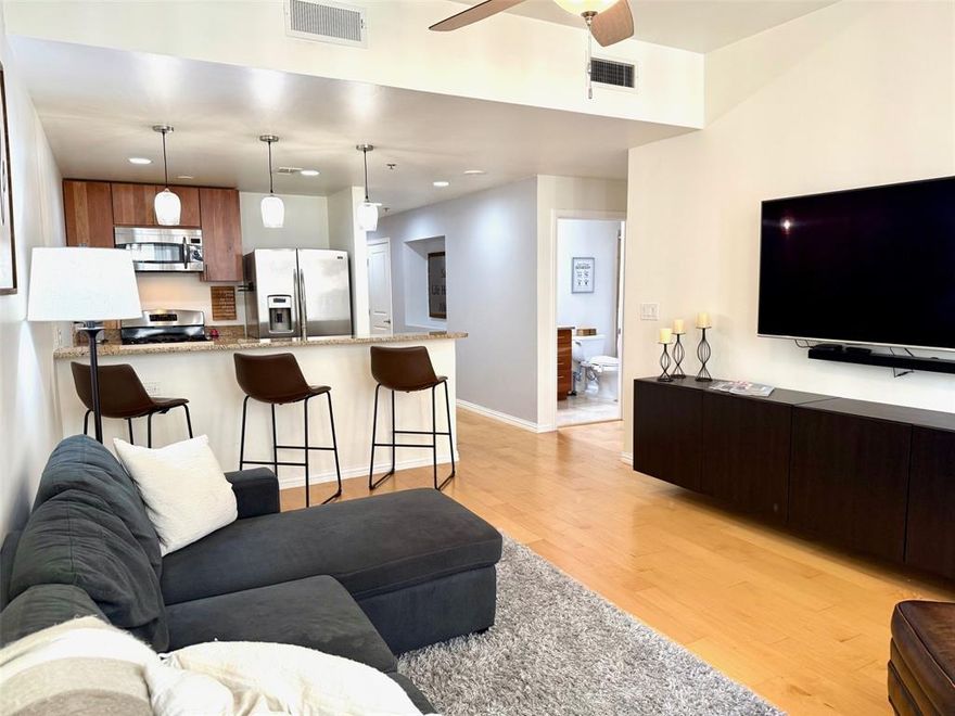 OPTION TO LEASE FULLY FURNISHED (or not so you can bring your own style) making your Dallas dreams even easier to attain!!! Discover affordable Downtown Dallas high-rise living. Top of the world 26th floor position offering light flooding thru both living and primary windows. Open kitchen granite covered breakfast bar, gas cooktop plus stainless fridge, microwave & dishwasher. Easy care flooring flows front to rear. Dedicated office at front of unity with full-size Maytag washer-dryer. Closets, closets, closets!  One dedicated and secured parking spot is assigned to this unit (it does not have an EV charger port). Imagine being so comfortable, leaving 'home' is unimaginable! Splash around the pool & hot tub, or entertain friends at one of the grilling stations & outdoor lounge areas. Stay fit in the fully outfitted gym & weight area, or chill in the resident’s lounge, theater, & meeting room. There's even a woodshop hobby room! Hosting visitors? Ask about the rentable guest unit. For the DIY enthusiast, there's a workshop! This vertical community thrives year-round with seasonal events. With 3 different eateries on-site, you can forego cooking. 24-hour concierge & secured, assigned parking ensure your safety & convenience. Most enticing: unbeatable location! Only two blocks from the JFK memorial, 10-minute walk to the Perot, stone's throw to the AT&T event areas... This is high-rise living redefined, where luxury meets affordability & community meets convenience.