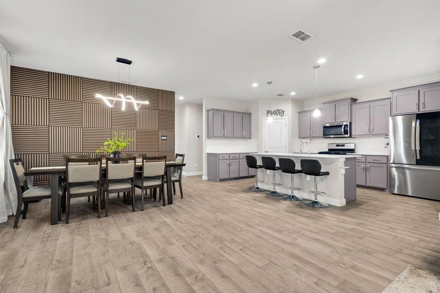 Spacious five-bedroom, two-and-a-half-bath home located in the Trails of Elizabeth Creek in Justin. Zoned for Northwest ISD, with the elementary school located within the community. The home features an open layout with accent walls, upgraded light fixtures, a custom built-in primary closet, a water softener system, and an RO drinking water system. The garage includes an epoxy-coated floor for added durability and easy maintenance. Community amenities include resort-style pools, parks, and walking paths. Conveniently located near Champions Circle Golf Course, Tanger Outlets, and major commuter routes.