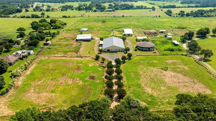 A horseman’s dream: Southern Sun Farm presents a unique opportunity to own a 80+- acre, fully equipped equine operation facility, located 30 mins south of Ft. Worth in Cleburne, just 5 miles from downtown area. The optimal combination of sandy loam soils, coastal bermuda pastures, & efficient amenities makes the property a turnkey setup for breeding, training, boarding, & more. Inside the main barn: 22 stalls, 2 wash stalls, 1 w hot water, 2 grooming stalls, vet stock, tack room, feed room, office, half bath, kitchen & laundry. Outside the main barn: 4 covered grooming stalls & 3 wash stalls. Barn 2 has 16 stalls, barn 3 has 8 stalls, both with water & electric. This property also features a large outdoor lighted arena, covered lighted round pen, & hay barn with electric. The vet clinic is equipped with water & electric, mare & foal vet stock, an office with heat & AC, and a full bathroom. Water is plumbed & in place in all pastures & paddocks. Entire property is fenced & cross-fenced.