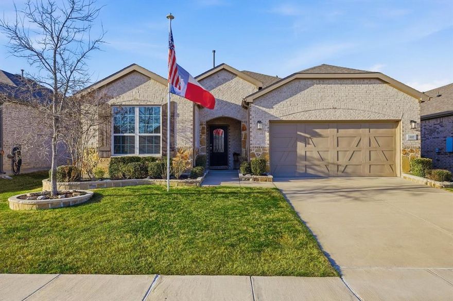 Welcome to this beautifully appointed Abbeyville floor plan located in the vibrant 55+ Del Webb community at Trinity Falls. Designed for low-maintenance living with thoughtful upgrades throughout, this home offers a bright, open layout that blends comfort, functionality, and timeless style.
The inviting entry features an upgraded decorative glass front door and opens to luxury vinyl plank flooring in a warm tawny oak tone flowing through the main living areas. The spacious gathering room is enhanced by a tray ceiling with crown molding and opens seamlessly to the kitchen and sunroom, creating an ideal space for everyday living and entertaining. The gourmet kitchen showcases 42-inch Alpine White maple cabinetry, quartz countertops, soft-close drawers, roll-out trays, raised dishwasher, designer subway tile backsplash, and recently upgraded high-end stainless steel appliances, including a built-in microwave-oven combo. Brushed nickel hardware completes the polished look. The sunroom provides additional living space and opens to a screened-in covered patio with roll down shades, offering added privacy, airflow, and a relaxed indoor-outdoor feel perfect for morning coffee or evening unwinding. A private study offers flexible space for a home office or reading room. The primary suite features a tray ceiling, dual sinks with quartz countertops, framed mirrors, and a spacious walk-in closet. Secondary bathroom upgrades include quartz counters and comfort-height cabinetry. Additional highlights include two-tone interior paint, recessed lighting, a mud bench entry, laundry room with upper cabinetry, and 2-inch faux wood blinds throughout. This home offers upgrades already completed and ready to enjoy without the wait or uncertainty of new construction. Residents enjoy resort-style amenities including a clubhouse, fitness center, pools, pickleball and bocce courts, dog park, fishing ponds, and miles of scenic walking and biking trails.