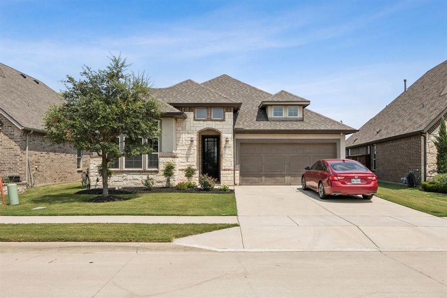 ***The sellers have recently refreshed the interior with new paint, offering a crisp, updated look.*** Step into this beautifully appointed 3-bedroom, 2-bathroom home in the sought-after Berkshire community of Fort Worth. Designed with an open-concept layout, this residence offers both comfort and modern style. The main living areas showcase rich wood plank flooring, while bedrooms provide plush carpet and bathrooms feature wood-grain ceramic tile for a refined finish. The kitchen is a true centerpiece with granite countertops, both a peninsula and island, stainless steel appliances, a farmhouse sink, and recessed lighting that flows into the dining and living areas. The inviting living room is anchored by a stunning stone-faced fireplace—perfect for entertaining or relaxing evenings. The private primary suite boasts a walk-in closet, double vanity, separate shower, and garden tub for unwinding. Additional highlights include a tankless water heater, a mudroom off the garage entry, utility closet with full-sized washer-dryer connections and cabinets, and a covered patio overlooking the backyard. Berkshire residents enjoy resort-style amenities, including a sparkling pool, clubhouse with rentable event space, playground, catch-and-release fishing pond, and scenic bike trails. Located in Northwest ISD with easy access to Hwy 287 and I-35W, the home is just minutes from Alliance Town Center, Presidio Towne Crossing, the historic Fort Worth Stockyards, Eagle Mountain Lake, and downtown Fort Worth. This home seamlessly blends thoughtful design, modern upgrades, and an unbeatable location—ready to welcome its next owners.