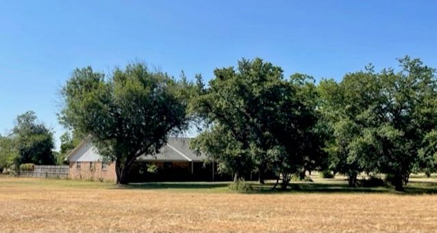 This property is a must see for the person looking for the serenity of country life with easy access to the convenience of the city.  Wild turkey, deer and fishing all on your property.  This 27 acres is situated in the country but less than 10 minutes from Waco and 2 minutes from a Lake Waco boat ramp. Property features a 3200 sq ft 4 bedroom home.  Home has gorgeous hardwood and tile floors, granite countertops in the kitchen, 2 living areas, 2 dining areas, 3 full baths, and an office.  The property has a 1000 sq ft workshop with electricity, a stock pond, a water well, a barn, and a creek located on the south side. Lots of wooded space and mature trees including: peach, pecan, pear, and plum trees.  Home is in the highly sought after Midway ISD.  A property with this much acreage, this close to the city is one you do not want to miss.