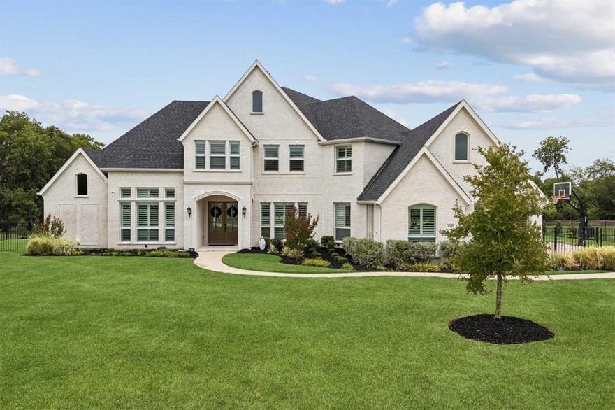 Welcome to this stunning, custom home! Completed construction in December 2022 and then meticulously maintained and thoughtfully upgraded. Gorgeous 7” wide hardwood floors, champagne gold plumbing fixtures, plantation shutters and a whole-home water filtration and softener system - to name a few! Enter through double doors to a grand, open-concept living space with abundant natural light and soaring ceilings. The heart of the home is the magnificent chef's kitchen, featuring Electrolux gas range appliances, premium countertops, and marble backsplash. The home offers five generously sized bedrooms - two on the first floor - each with its own dedicated full bathroom. The primary suite is a true sanctuary, complete with a spa-like ensuite bathroom featuring marble countertops, his and hers closets, and a massive shower with two shower heads. Upstairs, you'll find three large bedrooms, an extra bonus room, large loft area with a spacious playroom & media room wired for projector and surround sound. This smart home is equipped with a comprehensive system that allows you to control the thermostat, wired outdoor security cameras, video doorbell, and manage the front door lock, garage doors, and lights all from an app on your phone. Step outside to a vast, private backyard, secured by an iron gate and fence and enhanced with professional landscaping. The custom-designed Ruffhouse luxury playset is luxury like the home. This incredible playset features a built-in misting system and water cannons for endless summer fun, as well as LED lighting with multiple color options. Mature trees provide shade all afternoon. The oversized three-car garage offers not only ample space for vehicles but also an extra area for exercise equipment or other hobbies. Enjoy the unique benefits of Parker, country living with the proximity to all city conveniences and zoning for prestigious Allen ISD schools. This dream home offers a perfect blend of modern luxury and serene, private living.