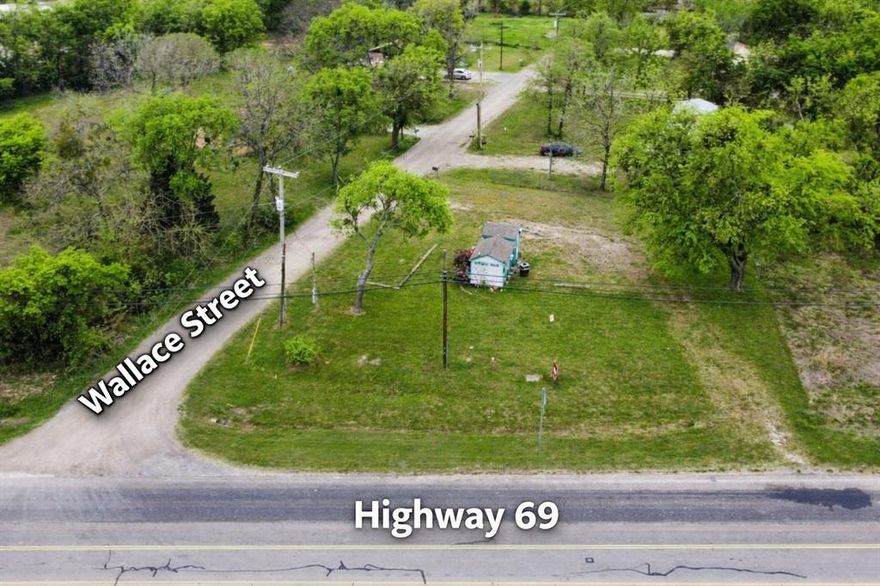 Prime .25-acre commercial corner lot located at the intersection of Hwy 69 South and Wallace Street in the growing community of Lone Oak, offering excellent visibility and high traffic exposure. Zoned as a commercial city lot with storage as an approved use, the property has previously operated as a successful snow cone stand, showcasing its potential for retail, food service, or other small business opportunities. Utilities are already in place with active water and electricity meters, along with access to city sewer, water, and trash services. This highly accessible corner location is just minutes from Lake Tawakoni and situated within a desirable school district, making it an ideal investment or business location in a rapidly developing area. The size and layout also make it a great option for a small office or professional space with strong visibility. An additional adjacent approximately .20-acre parcel may be available in the future, offering potential for expansion (buyer to verify).