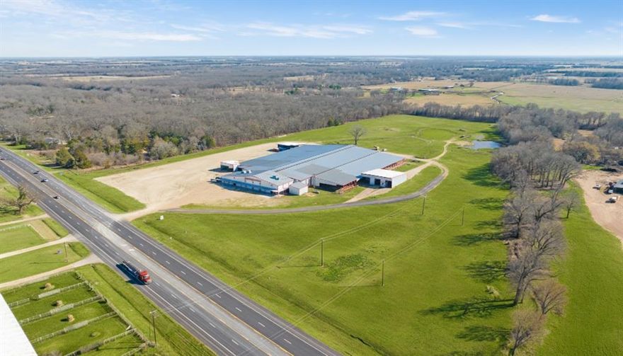 Diamond H Event Center
Premier Livestock, Agricultural & Multi-Purpose Event Facility

Diamond H Event Center is a large-scale, purpose-built livestock and event facility strategically located along US Highway 82 in Paris, Texas approximately two hours from the Dallas-Fort Worth metroplex. Offering over 100,000 square feet of covered improvements on a highly visible and accessible tract, this 30-acre institutional-grade venue is designed to accommodate livestock exhibitions, agricultural competitions, corporate events, community functions, and multi-day regional gatherings.
Positioned in Northeast Texas serving Texas, Oklahoma, Arkansas, and Louisiana markets Diamond H presents a rare opportunity to acquire a turnkey, revenue-generating event center with substantial expansion potential.

Diamond H Event Center was purpose-built to support high-volume livestock operations and structured event programming. The facility layout allows for smooth traffic flow, efficient loading unloading, and safe separation of livestock and spectators.
The expansive covered structure includes large open-span steel framing with high ceilings and strong ventilation capacity. Interior layout supports:

Livestock show rings
Holding pens
Stalling configurations
Flexible reconfiguration for cattle, swine, lamb, or goat events
Wide interior access lanes allow efficient animal flow and exhibitor movement. The steel framing and engineered construction provide long-term durability and low-maintenance operation.

Given its size and utility capacity, Diamond H can evolve into a full-scale regional agricultural complex or diversified commercial event destination.