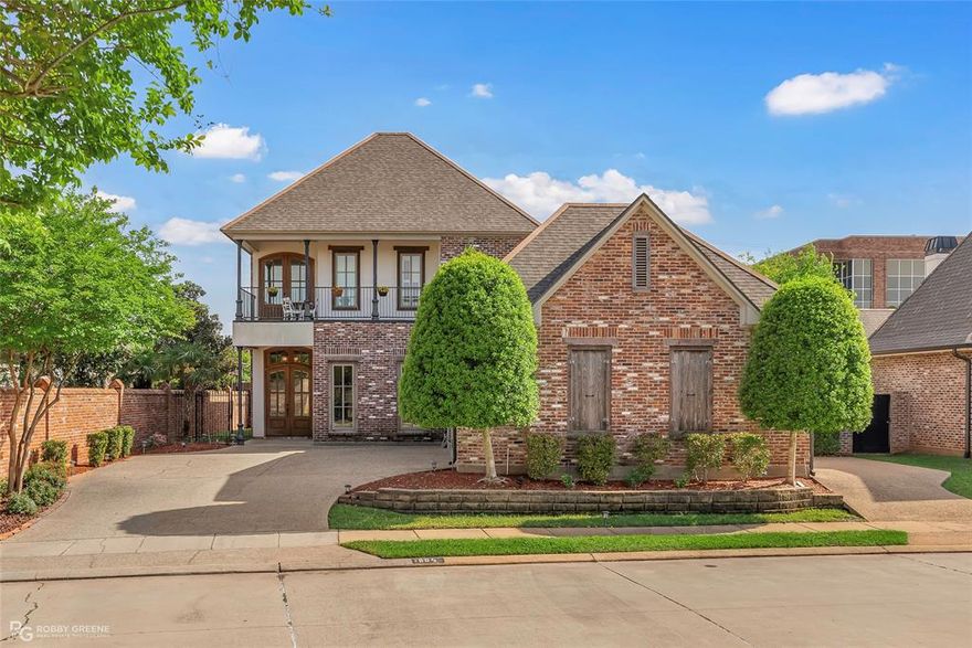 Welcome to this immaculate home located in the highly desirable Oak Alley neighborhood, where stunning curb appeal and a gorgeous front balcony create an unforgettable first impression. Inside, the heart of the home is a chef’s dream kitchen featuring sleek stainless steel appliances, an oversized island perfect for gatherings, a spacious pantry, and ample storage. The kitchen flows seamlessly into the open-concept living room, complete with custom built-ins on either side of the fireplace, offering both charm and functionality. The large primary suite is a true retreat, showcasing a beautiful wooden accent ceiling and a spa-like ensuite bathroom. Here, you'll find a double vanity, a large walk-in shower, a soaking tub with warm wood accents, and a generous walk-in closet. The home also offers three additional bedrooms, two more full bathrooms, and a versatile flex room—ideal for a home office, gym, or playroom. An in-home elevator adds both convenience and accessibility, making this home ideal for all lifestyles. Additional features include a spacious laundry room with a sink, a mudroom with built-in storage leading to the attached two-car garage, and thoughtful finishes throughout. Step outside to enjoy the expansive covered patio with a full outdoor kitchen—perfect for grilling, entertaining, or relaxing with friends and family. The large backyard provides plenty of room for children, pets, or future outdoor additions. This exceptional home offers luxury, comfort, and practicality all in one—don’t miss your opportunity to make it yours.