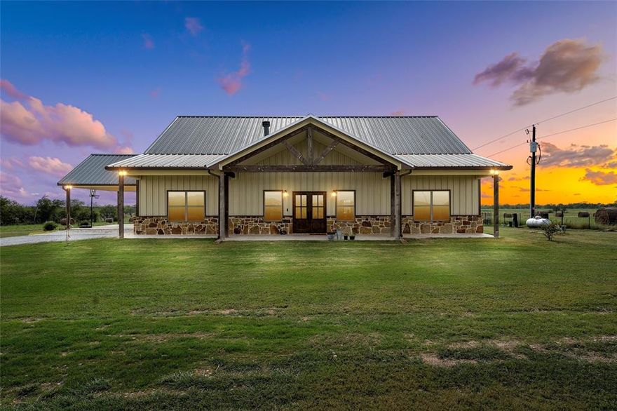 Stunning Modern Farmhouse on 5± Acres – Mart, Texas
(Option to purchase an additional 5 acres)

Welcome to this beautifully designed home, perfectly set on 5± acres with the opportunity to add even more space. Inside, you’ll find gleaming stained concrete floors, rich custom cabinetry, stainless steel appliances, and an impressive stone fireplace that anchors the living area.
The chef’s kitchen is a showstopper with a large granite island, double ovens, and a statement light fixture that sets the tone for gatherings.
The isolated primary suite offers a spa-like bath with a relaxing soaker tub and a generous walk-in closet. Two additional bedrooms downstairs provide plenty of room for family or guests, while an upstairs suite gives everyone privacy.

Step outside to enjoy a massive covered porch and patio—complete with built-in Bluetooth speakers—ideal for entertaining or unwinding while you watch the sunset over your acreage.

All of this is located just 3 miles from Tradinghouse Lake, about 1 hour 35 minutes from Dallas, and 1 hour 50 minutes from Austin — giving you a peaceful retreat without sacrificing access to major cities.

This move-in-ready property blends rustic charm with modern convenience, giving you the perfect balance of country living and comfort.
