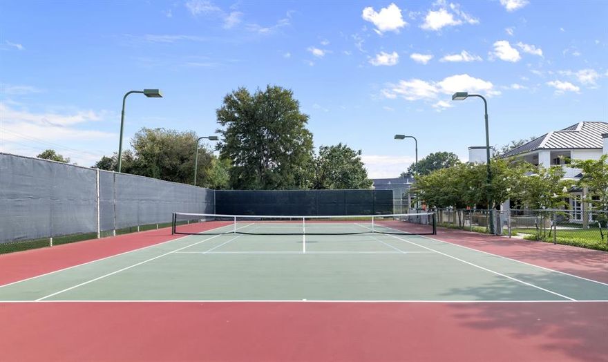 Live a life of luxury and leisure in this modern masterpiece, set on nearly an acre of manicured grounds. This isn’t just a home; it’s your own private resort, designed for both vibrant entertaining and serene relaxation. The outdoors is where the magic happens. Imagine a beautiful afternoon spent playing on your very own full-size private tennis court—complete with lighting for evening matches—which also features a dedicated pickleball court. The expansive yard offers a large green space surrounded by mature trees, perfect for quiet afternoons or a game of frisbee. When it’s time to unwind, gather around the firepit under the stars or take a refreshing dip in the sparkling pool. An expansive covered patio hosts a full outdoor kitchen, making it effortless to host unforgettable barbecues and poolside parties. A grand circular drive provides an elegant welcome for you and your guests. Inside, the home is a celebration of light and space. Walls of windows and sliding glass doors blur the line between the indoors and your private outdoor sanctuary. The formal dining room is perfect for hosting elegant dinner parties, featuring heated built-ins for serving, while the polished marble flooring adds a touch of timeless sophistication. The gourmet kitchen is the heart of the home, equipped with a Sub-Zero refrigerator, a 6-burner gas cooktop, double dishwashers, double ovens, and a warming drawer. With polished granite on the floors and countertops, Seimatic cabinetry, and artistic lighting, this space is both beautiful and functional. This home offers ultimate comfort for everyone. The primary suite is a true spa-like retreat with dual sinks, a luxurious walk-in shower with dual heads and body sprays, and two separate toilets. The secondary bedrooms have ensuite baths and walk-in closets, ensuring every guest or family member enjoys their own private sanctuary. Close to top-tier private schools and high-end retail and dining, with easy access to the Dallas North Tollway.