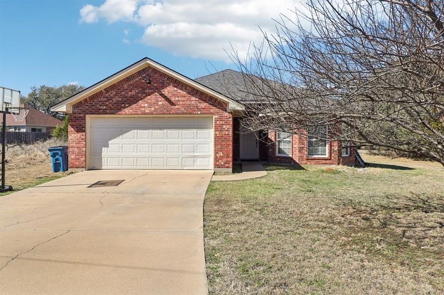 Live the ultimate lake lifestyle in Canyon Creek, a guard-gated community with boat ramp, pool, clubhouse, tennis courts, playground, and stunning views backing up to the Brazos River! This home impresses with low-maintenance tile throughout common areas and cozy carpeted bedrooms. The kitchen features a breakfast bar perfect for casual meals or entertaining, while the primary suite delivers dual sinks, a soaking tub, and a separate shower—your private retreat. Don’t miss this opportunity to combine comfort, convenience, and resort-style living—schedule your tour today! Discounted rate options and no lender fee future refinancing may be available for qualified buyers of this home. Current interest rate may be assumable. Raw land with city water and city electricity is attached to this parcel.